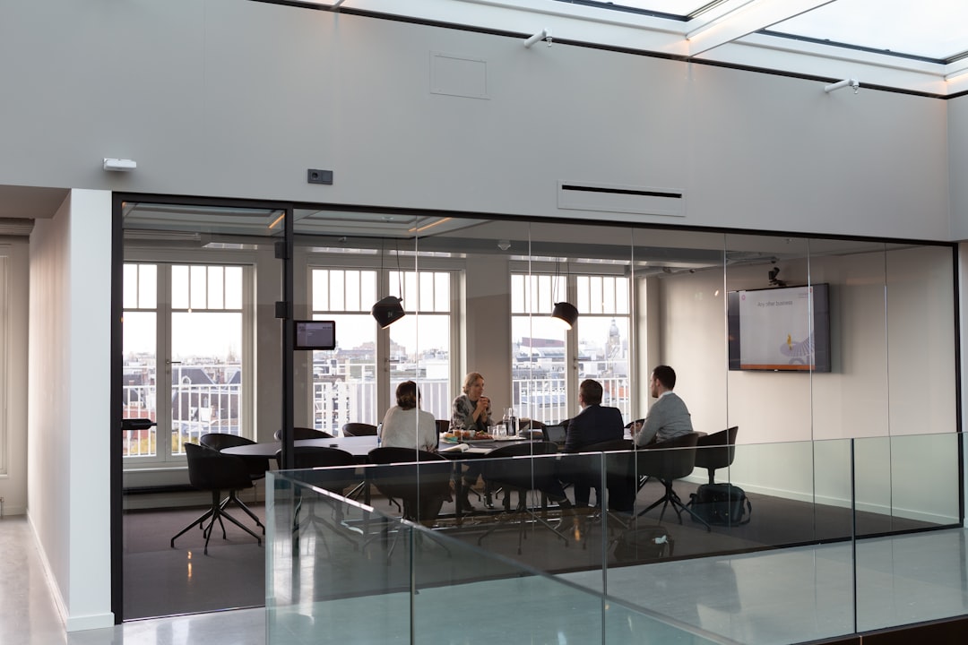 People sitting on chair inside building — photo by Rodeo Project Management Software on Unsplash