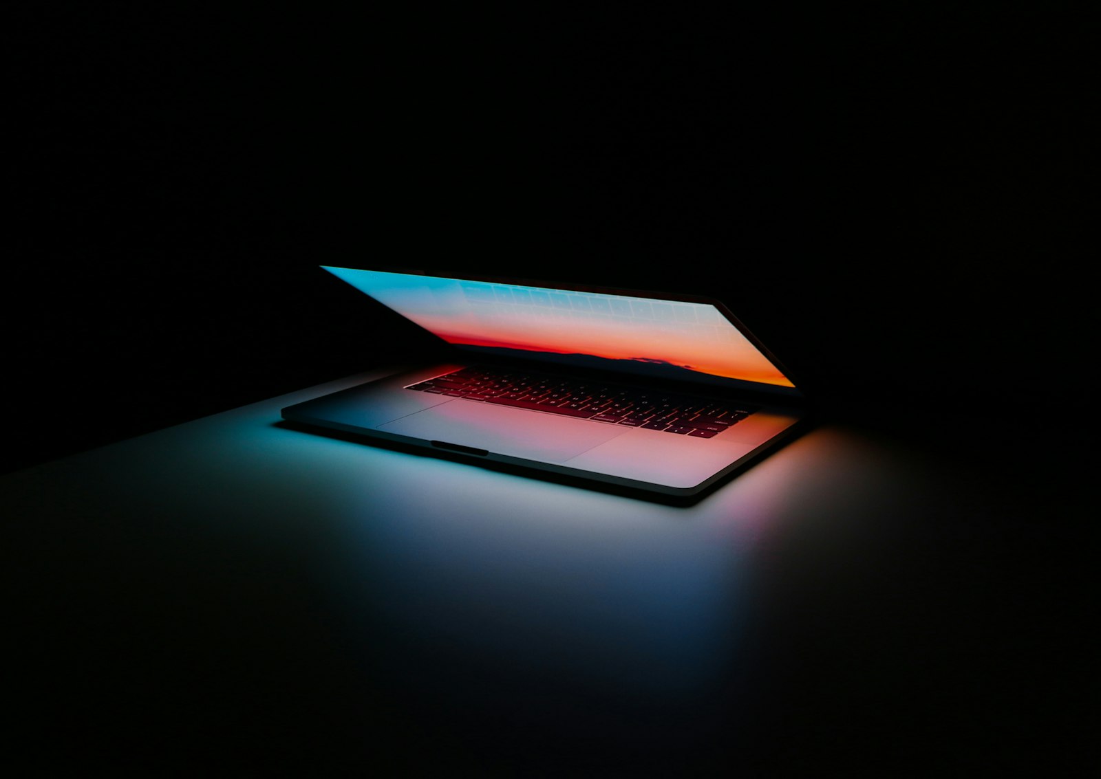 Gray and black laptop computer on surface — photo by Ales Nesetril on Unsplash