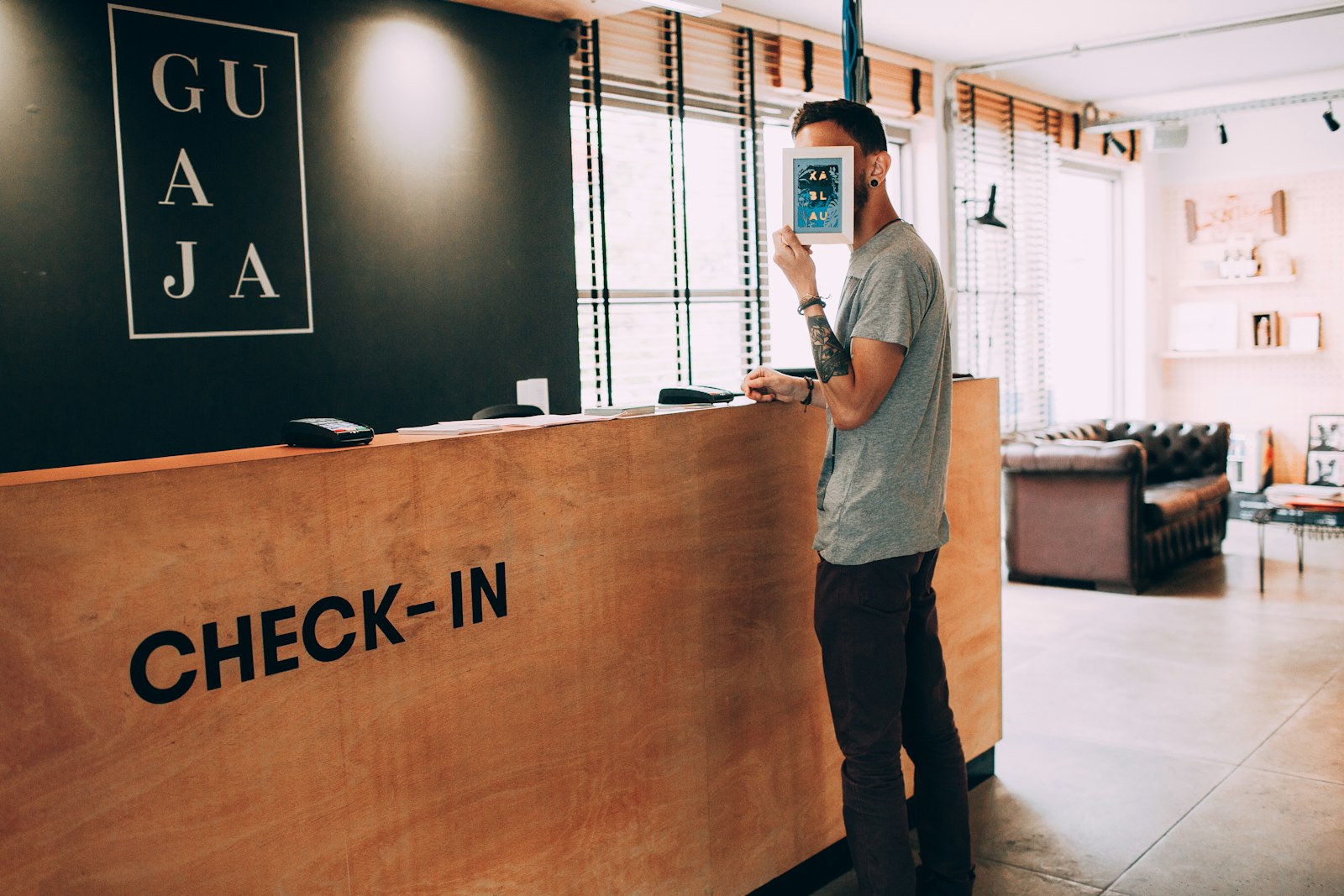 Man standing beside counter — photo by Helena Lopes on Unsplash