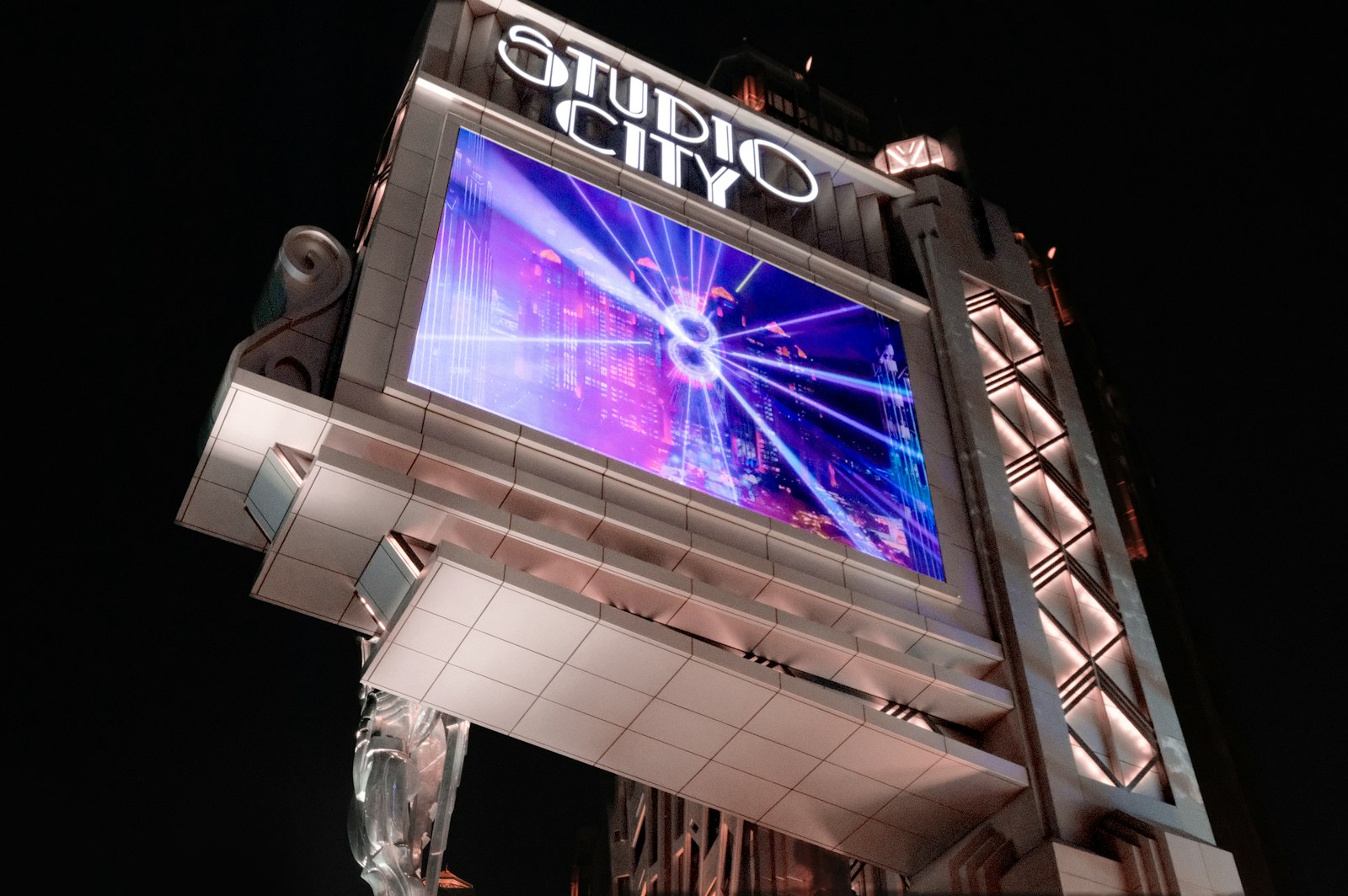 Studio city sign with bright lights at night — photo by MACAU PHOTOGRAPHY on Unsplash